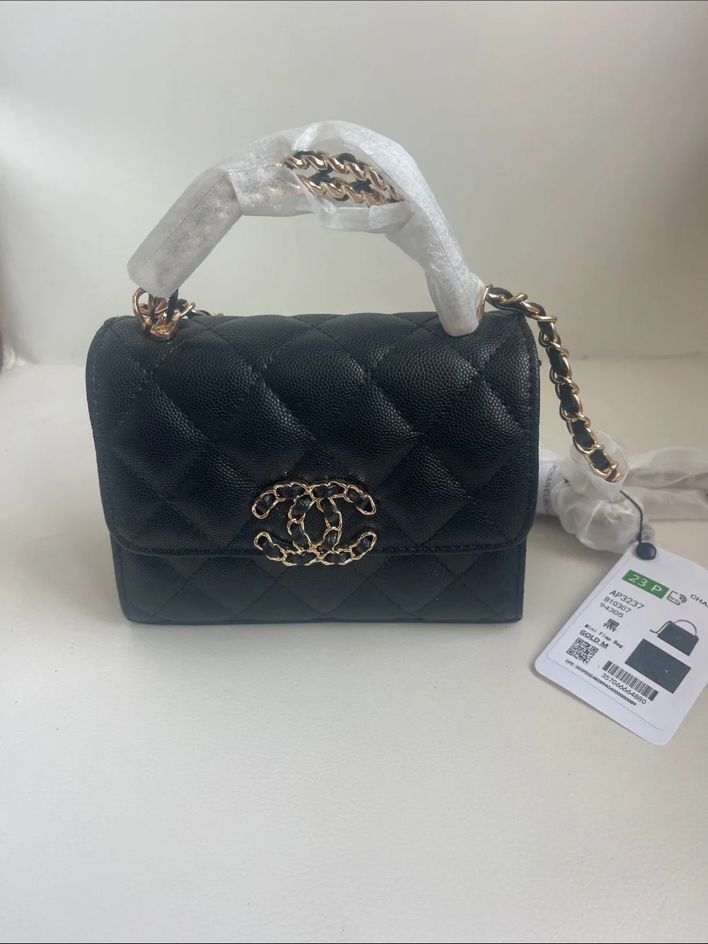 CHANEL 23 P Black Quilted Mini Top-Handle Bag with Gold Chain Hardware